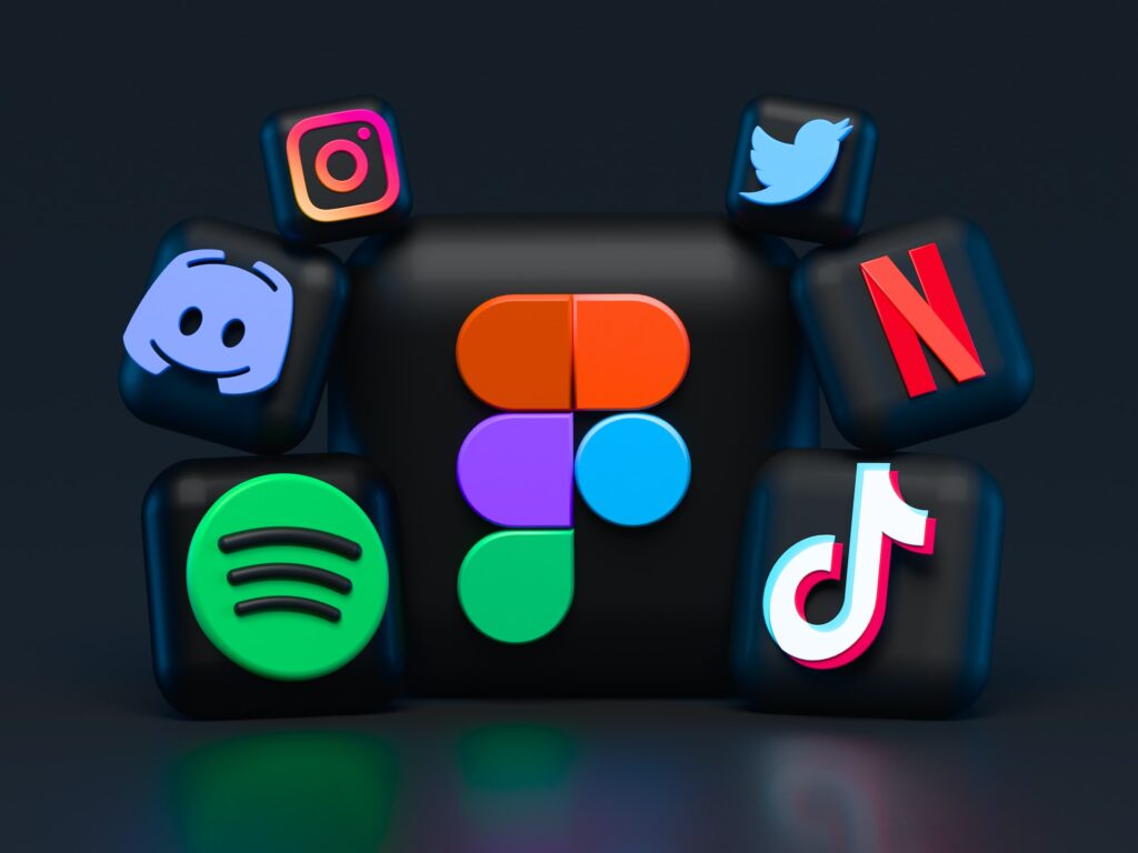 Floating social media app icons on a dark background showing a range of platforms which you can utilise for social media marketing